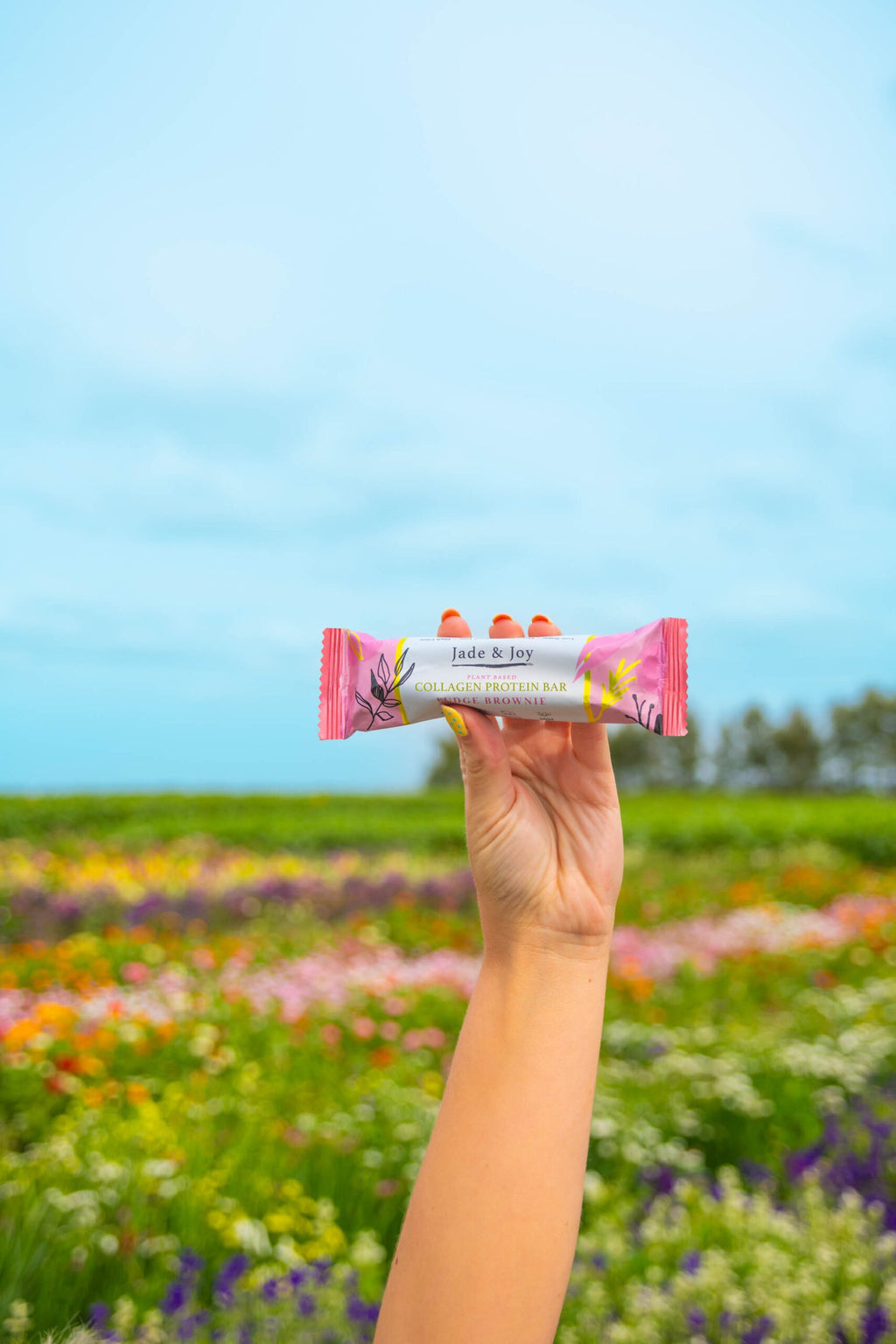 fudge brownie Jade Joy Vegan Collagen Protein Bar  plant based gluten free flower field
